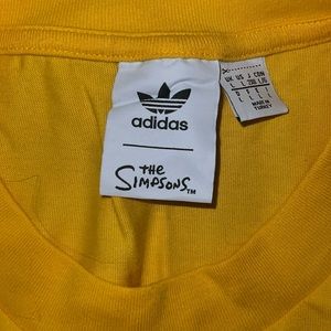 Adidas The Simpsons shirt.